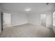 Large bedroom features neutral carpet, recessed lighting, and access to private bathroom at 3655 Nc-62, Burlington, NC 27217