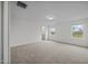 This bedroom boasts large windows providing great natural light, neutral carpet, and is freshly painted at 3655 Nc-62, Burlington, NC 27217