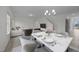 Bright dining area featuring a marble table with seating for six, and modern chandelier at 3655 Nc-62, Burlington, NC 27217