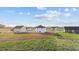 New home's exterior features white siding, black roof, and a large, undeveloped lot at 3655 Nc-62, Burlington, NC 27217