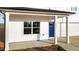 Inviting covered front porch with white columns and a bright blue entry door at 3655 Nc-62, Burlington, NC 27217