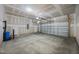 Spacious garage with concrete flooring and large garage door at 3655 Nc-62, Burlington, NC 27217
