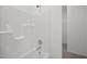 This clean shower-tub features bright white tub surround at 3655 Nc-62, Burlington, NC 27217
