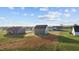 Birds eye view of a gray home with a large back yard in a rural area at 3689 Nc 62, Burlington, NC 27217