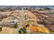 Expansive aerial view of a new home construction site featuring multiple single-Gathering homes in a rural setting at 3689 Nc 62, Burlington, NC 27217