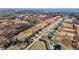 Beautiful aerial panorama of homes nestled within a serene environment featuring both homes and tree covered areas at 3689 Nc 62, Burlington, NC 27217