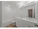 Beautiful bathroom featuring double sinks, modern fixtures, and a shower-tub combination at 3689 Nc 62, Burlington, NC 27217