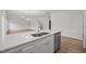 Bright kitchen with a breakfast bar, stainless sink and appliances, and modern lighting fixtures at 3689 Nc 62, Burlington, NC 27217