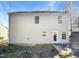 Back of house with a covered back door and well-maintained backyard at 3810 Chehaw Dr, Raleigh, NC 27610