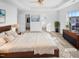 Spacious main bedroom features a ceiling fan, carpet, walk in closet, and large window at 3810 Chehaw Dr, Raleigh, NC 27610