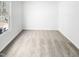 A bright bedroom with neutral walls, carpeting and a window at 3810 Chehaw Dr, Raleigh, NC 27610
