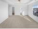 Bright bedroom features a ceiling fan, carpet, walk in closet, and large window at 3810 Chehaw Dr, Raleigh, NC 27610