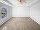 Large bedroom featuring a ceiling fan, carpet, and large bright window at 3810 Chehaw Dr, Raleigh, NC 27610