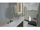 Modern bathroom featuring white marble, a glass-enclosed shower, sleek fixtures, and a black marble shower base at 3813 Peaceful Creek Trl, Zebulon, NC 27597