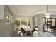Sunlit dining room with a modern table setting and a seamless transition to the outdoor living area at 3813 Peaceful Creek Trl, Zebulon, NC 27597