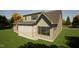 Exterior view of a two-story house with a screened porch and an outdoor living space at 3813 Peaceful Creek Trl, Zebulon, NC 27597