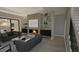Modern living room with fireplace, built-in shelves, and hardwood floors, perfect for entertaining at 3813 Peaceful Creek Trl, Zebulon, NC 27597