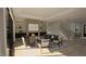 Bright living room with fireplace, ample seating, and large windows offering plenty of natural light at 3813 Peaceful Creek Trl, Zebulon, NC 27597