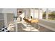Bright office with modern desk setup, large windows offering natural light, and chic decor at 3813 Peaceful Creek Trl, Zebulon, NC 27597