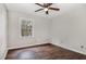 Simple bedroom with hardwood floors and ceiling fan at 41 S Sussex Dr, Smithfield, NC 27577