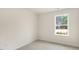 Bright bedroom with carpeted floor and large window at 412 Honeycutt Oaks Dr, Angier, NC 27501