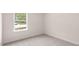 Well-lit bedroom with carpeted floor and window at 412 Honeycutt Oaks Dr, Angier, NC 27501