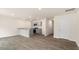 Open concept kitchen with gray cabinets, granite countertops, and stainless steel appliances at 412 Honeycutt Oaks Dr, Angier, NC 27501