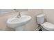 Clean bathroom with pedestal sink and toilet at 422 Honeycutt Oaks Dr, Angier, NC 27501