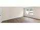 Spacious bedroom featuring wood-look flooring and large window at 422 Honeycutt Oaks Dr, Angier, NC 27501