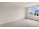 Bright bedroom with carpeted floor and large window at 422 Honeycutt Oaks Dr, Angier, NC 27501
