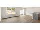 Bright dining area with vinyl plank flooring and sliding glass door to patio at 422 Honeycutt Oaks Dr, Angier, NC 27501