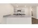Modern kitchen with gray cabinets, granite countertops, and stainless steel appliances at 422 Honeycutt Oaks Dr, Angier, NC 27501