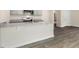 Modern kitchen with gray cabinets, granite countertops, and stainless steel appliances at 422 Honeycutt Oaks Dr, Angier, NC 27501