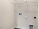 Laundry closet with shelving and hookups at 422 Honeycutt Oaks Dr, Angier, NC 27501