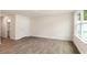 Open living room with neutral walls and vinyl plank flooring at 422 Honeycutt Oaks Dr, Angier, NC 27501