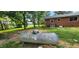 Brick home with large propane tank in backyard at 4224 Us 401, Louisburg, NC 27549