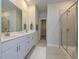 Double vanity bathroom with a large shower and walk-in closet at 483 White Birch Ln, Angier, NC 27501
