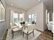 Dining area with hardwood floors, modern table, and access to patio at 483 White Birch Ln, Angier, NC 27501