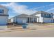 New house with gray siding, two-car garage, and a front yard at 483 White Birch Ln, Angier, NC 27501