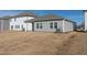 Gray house exterior with a covered patio and grassy yard at 483 White Birch Ln, Angier, NC 27501