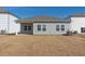 Gray house exterior with a covered patio and grassy yard at 483 White Birch Ln, Angier, NC 27501
