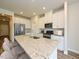Modern kitchen with white cabinets, granite countertops, and a large island at 483 White Birch Ln, Angier, NC 27501