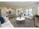 Spacious living room with hardwood floors, neutral decor, and large windows at 483 White Birch Ln, Angier, NC 27501