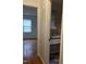 Bathroom featuring a pedestal sink and open doorway with a view into a living room space at 494 S Mason St, Coats, NC 27521