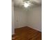 Bright bedroom with hardwood floors, ceiling fan, and neutral wall color at 494 S Mason St, Coats, NC 27521