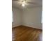 Bedroom featuring gleaming wood floors and lots of light at 494 S Mason St, Coats, NC 27521