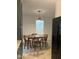 Cozy kitchen featuring a wood table with chairs, and modern appliances with an open doorway at 494 S Mason St, Coats, NC 27521