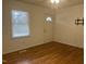 Bright room with hardwood floors, ceiling fan, and a window at 494 S Mason St, Coats, NC 27521