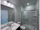 Well-lit bathroom with a shower and toilet, bright quartz countertops, and vanity lighting at 50 Cordoba Dr, Franklinton, NC 27525