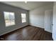 Bedroom with hardwood floors, two windows, and neutral paint, creating a serene atmosphere at 50 Cordoba Dr, Franklinton, NC 27525